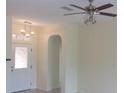 Bright living room with a ceiling fan and a view into another room at 8781 Sw 82Nd Court Rd, Ocala, FL 34481