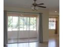 Living room view to the screened in patio with large sliding glass doors at 8781 Sw 82Nd Court Rd, Ocala, FL 34481