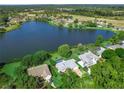 Breathtaking aerial view of a lakeside community with lush landscaping and stunning water views at 95 Hickory Loop, Ocala, FL 34472