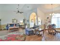 Spacious living room featuring modern furnishings, vaulted ceilings and arched doorway, perfect for relaxation and entertaining at 2478 Nw 50Th Ave, Ocala, FL 34482