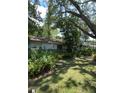 Backyard view shows dense landscaping at 2927 Se 13Th St, Ocala, FL 34471