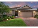 Charming single-Gathering home boasts a brick driveway and a two-car garage at 5587 Nw 40Th Pl, Ocala, FL 34482