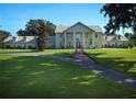 Classic estate home features a manicured lawn and tree lined drive at 5765 Nw 110Th St, Ocala, FL 34482