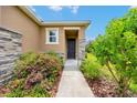 Close-up of the home's entrance, featuring a stylish front door and stone accents at 6318 Sw 89Th Lane Rd, Ocala, FL 34476