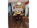 Dining room with seating for six, complete with elegant lighting and decor at 8343 Sw 105Th Pl, Ocala, FL 34481