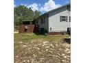 Exterior showcasing a well-maintained fence, enhancing privacy and curb appeal of the home at 1013 Nw Mandrake Dr, Dunnellon, FL 34431