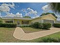 Charming home with a sidewalk and a bench on the porch at 10699 Se 178Th St, Summerfield, FL 34491