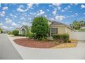 Well-maintained home with lush landscaping and inviting curb appeal at 1204 Flamingo Pl, The Villages, FL 32162