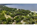 A high aerial view of waterfront community by a lake at 12335 Se 130Th Ct, Ocklawaha, FL 32179