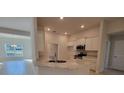Modern eat-in kitchen with stainless steel appliances and granite countertops at 13977 Sw 81St St, Dunnellon, FL 34432