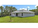 A well-manicured lawn complements the home's exterior, creating a peaceful and inviting backyard space at 226 Locust Ln, Ocala, FL 34472