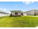 Well-maintained home exterior with a lush green lawn at 7513 Sw 56Th Pl, Ocala, FL 34474
