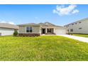 Well-maintained home exterior with a lush green lawn at 7513 Sw 56Th Pl, Ocala, FL 34474
