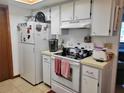 Functional kitchen with white appliances and ample cabinet space at 8368 Sw 105Th Pl, Ocala, FL 34481