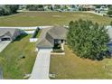 Aerial view of home with a large, fenced backyard and mature tree at 9952 Sw 58Th Ave, Ocala, FL 34476