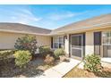 Inviting front entrance with colorful flowers and manicured shrubs at 9952 Sw 58Th Ave, Ocala, FL 34476