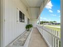 Welcoming covered front porch with stone accents and ample space for outdoor seating at 10210 Sw 93Rd Ave, Ocala, FL 34481