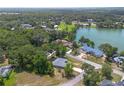 Aerial view of a cozy home near a scenic lake, offering a blend of natural beauty and peaceful living at 11645 Mallard Ct, Dunnellon, FL 34432