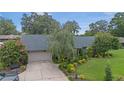 Charming home with a well-maintained lawn, beautiful landscaping, and a cozy bench at 2441 Se 38Th St, Ocala, FL 34480