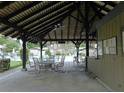 Community pavilion featuring a covered area with tables and chairs, ideal for social gatherings at 3856 Ne 17Th Street Cir, Ocala, FL 34470
