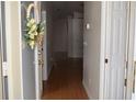 Inviting entryway with wood flooring and decorative wreath on the front door at 3904 Ne 22Nd St, Ocala, FL 34470