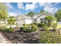 Beautiful single-story home with a neatly landscaped front yard and a spacious two-car garage at 5151 Sw 39Th St, Ocala, FL 34474