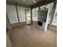 Relaxing sunroom with tiled flooring, screened windows, and natural light at 7802 Sw 114Th Loop, Ocala, FL 34476