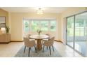 Cozy dining area with bay window and sliding glass doors to the backyard at 8205 Sw 100Th Lane Rd, Ocala, FL 34481