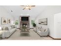 Bright living room with a brick fireplace, neutral furniture, and plenty of natural light at 8205 Sw 100Th Lane Rd, Ocala, FL 34481