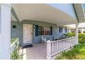 Cozy front porch with seating, charming accents, and a welcoming entrance to this single-story home at 8431 Sw 93Rd Pl # F, Ocala, FL 34481