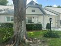 Daytime view of charming single-story home featuring manicured landscaping at 9255 Sw 90Th Ct # B, Ocala, FL 34481