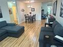 Inviting living room and dining area features hard surface flooring and neutral decor at 9255 Sw 90Th Ct # B, Ocala, FL 34481