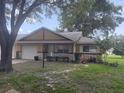 Charming single-story home with a well-manicured lawn and a one car garage at 9722 Sw 95Th Ct # C, Ocala, FL 34481
