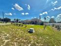 Charming front yard with a well-maintained lawn, complemented by neatly arranged bushes and clean landscaping at 10405 Sw 47Th Ave, Ocala, Florida, FL 34476