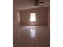 Bright bedroom featuring tile flooring and a window letting in natural light at 2426 Maple Ave, Sanford, FL 32771