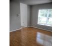 Inviting living room with wood-look floors and a large window for ample natural light at 3223 Sw 41St Ave, Ocala, FL 34474