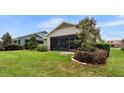 Well-maintained backyard featuring a manicured lawn and mature landscaping at 4232 Nw 56Th Ct, Ocala, FL 34482
