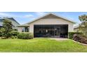 The home features a screened-in porch overlooking the landscaped backyard at 4232 Nw 56Th Ct, Ocala, FL 34482