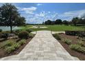 Scenic view of a beautifully landscaped golf course with a paved walkway at 4232 Nw 56Th Ct, Ocala, FL 34482