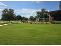 Expansive green space with golf course views and an decorative equine statue at 4232 Nw 56Th Ct, Ocala, FL 34482