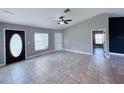 Inviting living room with tile floors, neutral walls, and plenty of natural light at 5320 Sw 128Th Pl, Ocala, FL 34473