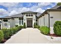 Impressive home with landscaped walkway leading to a striking modern front door at 5845 Sw 43Rd Street Rd, Ocala, FL 34474