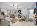 Cozy living room with tile flooring and natural light creates a welcoming atmosphere to relax in at 7961 Midway Drive Ter # J102, Ocala, FL 34472