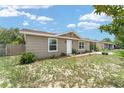 Charming single-story home featuring neutral siding, brick accents, white trim and front door, and well-maintained landscaping at 8940 Se 87Th Ter, Ocala, FL 34472