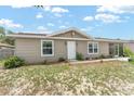 Charming single-story home featuring neutral siding, brick accents, white trim and front door, and well-maintained landscaping at 8940 Se 87Th Ter, Ocala, FL 34472