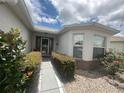 Inviting front entrance with decorative plants and manicured landscaping at 9730 Sw 90Th St, Ocala, FL 34481