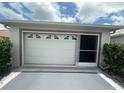 Garage with automatic door plus added screen slider at 9730 Sw 90Th St, Ocala, FL 34481