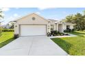 Lovely single-story home with a two car garage, beautiful landscaping and inviting curb appeal at 9957 Sw 45Th Ave, Ocala, FL 34476