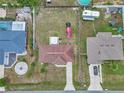 Aerial view of home showcasing the roof, backyard, surrounding properties and neighborhood layout at 14762 Sw 22Nd Court Rd, Ocala, FL 34473