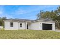 Beautiful single-story home featuring a sleek design and a spacious two-car garage at 1686 Sw 168Th Loop, Ocala, FL 34473